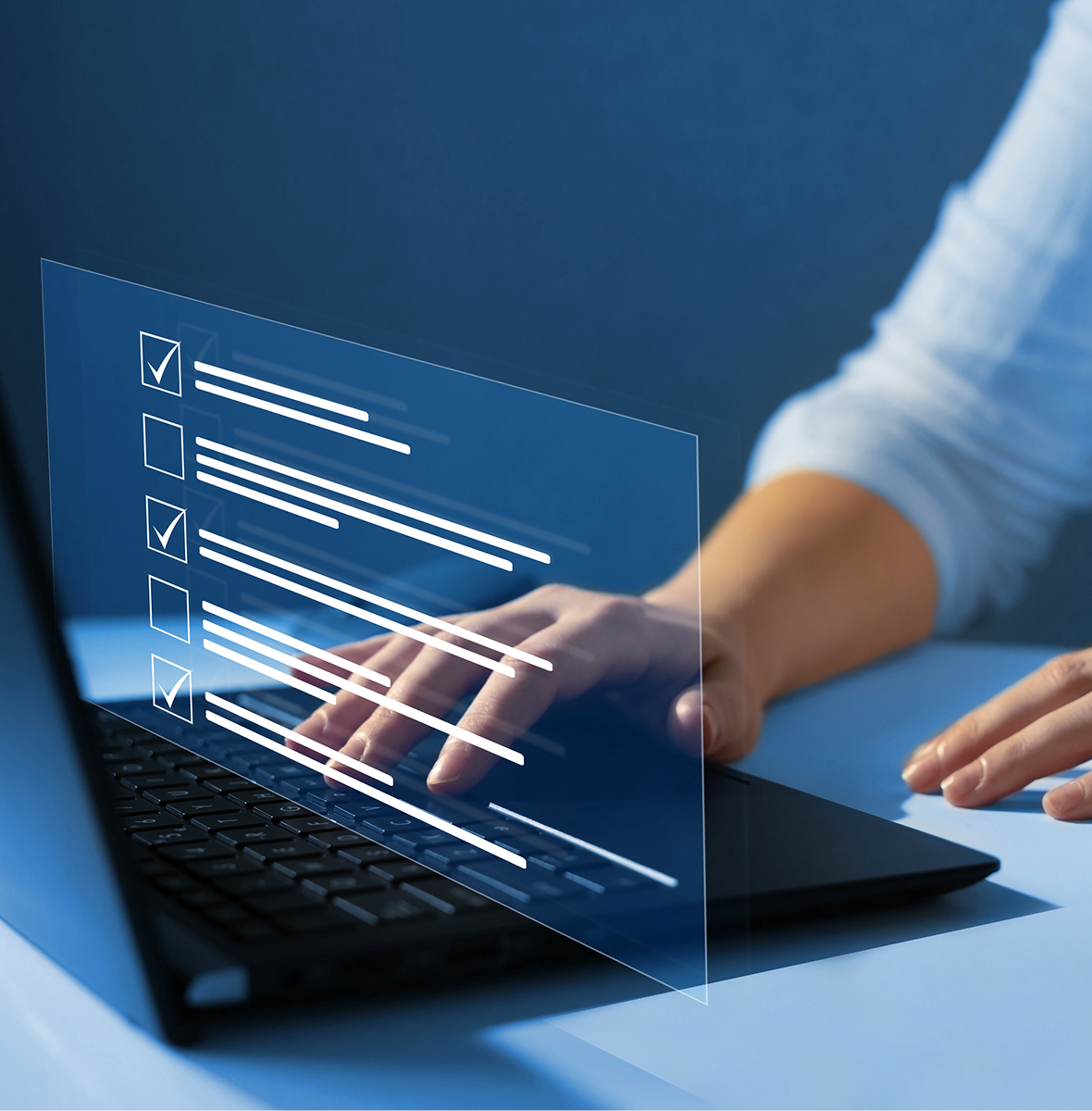 Person interacting with virtual checklist on laptop.